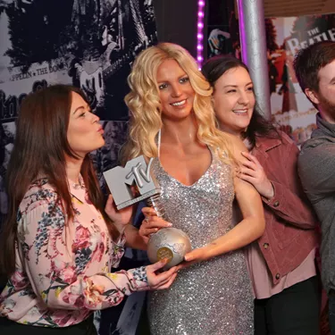 Guests with Britney Spears wax figure at Madame Tussauds Blackpool