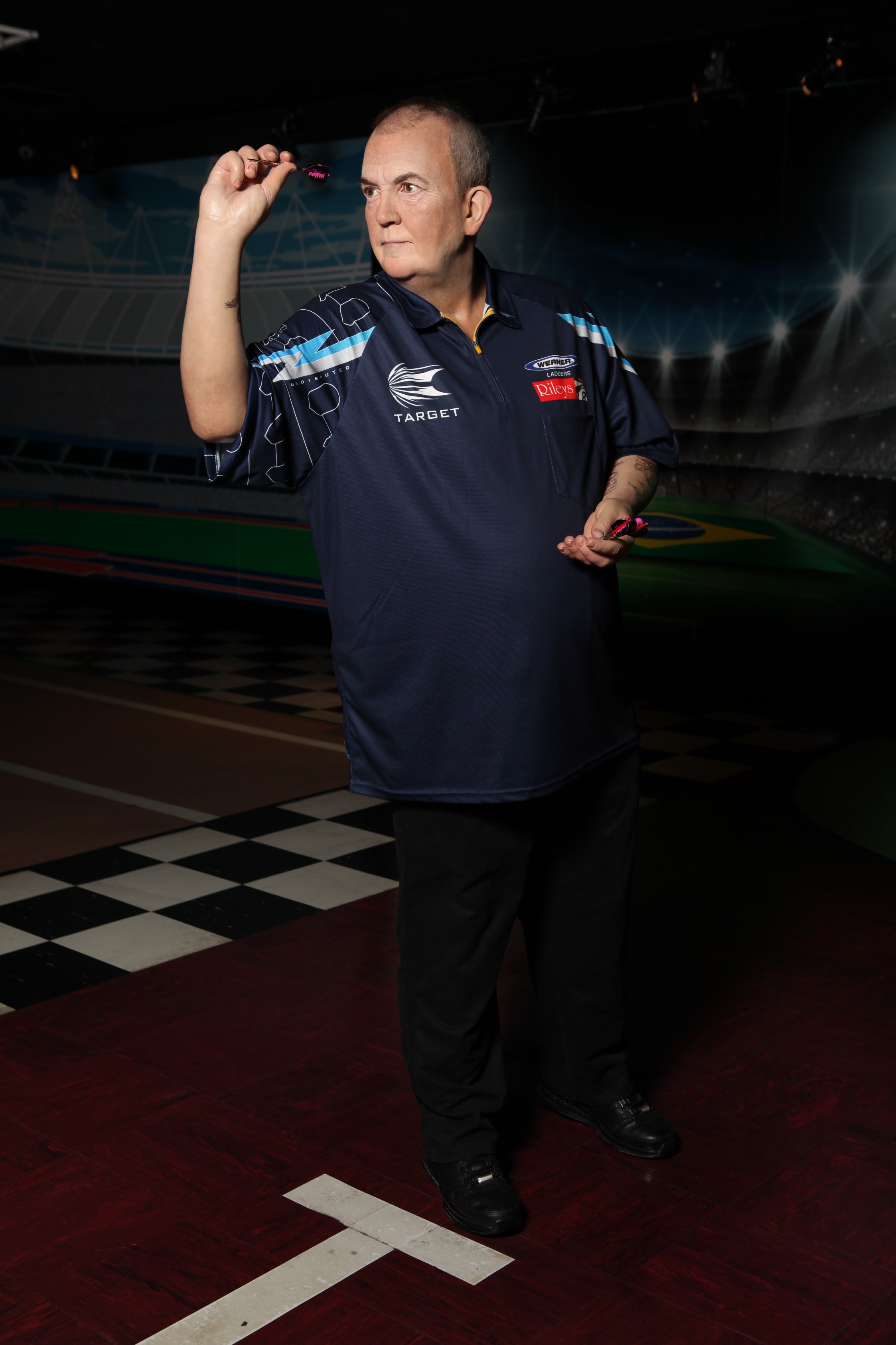 Phil Taylor wax figure throwing a dart at Madame Tussauds Blackpool