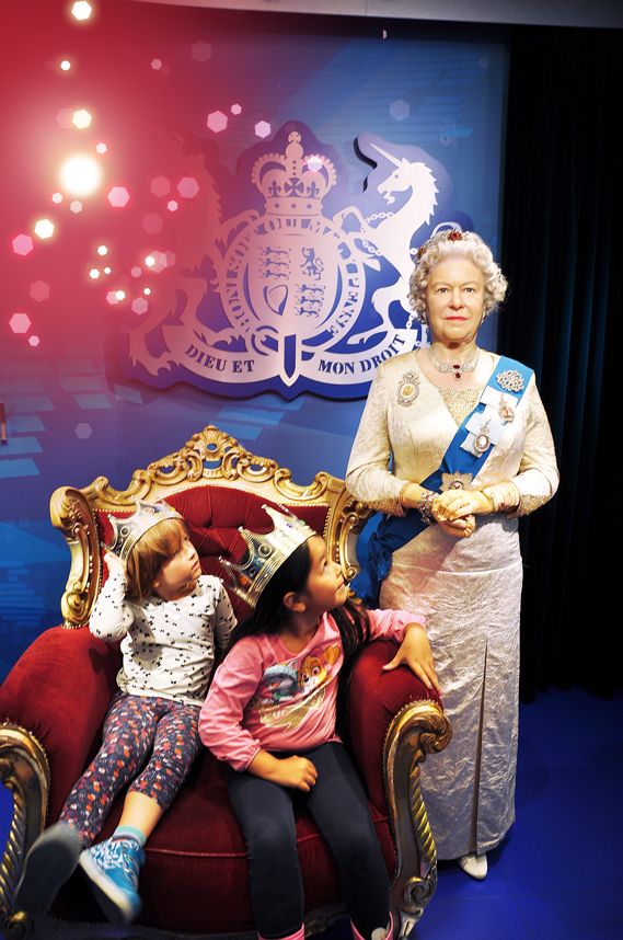Girls visiting the Queen Elizabeth II at Madame Tussauds™ Vienna