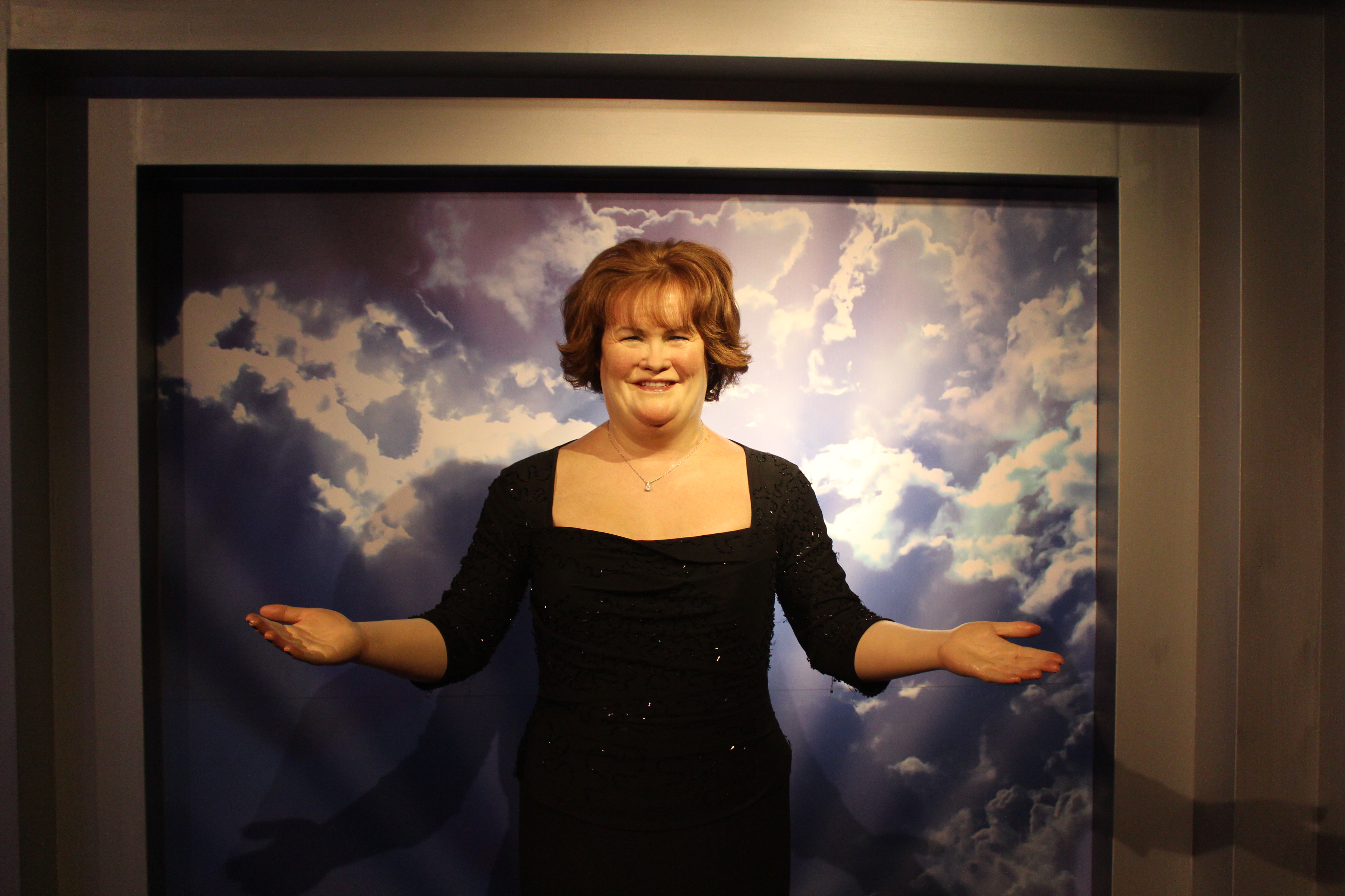 Susan Boyle's wax figure with her arms out at Madame Tussauds Blackpool