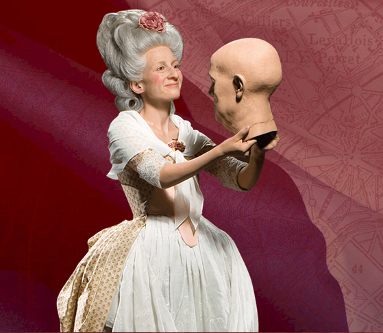 Madame Tussaud herself holding a wax head figure