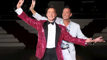 Craig Revel strikes the same dance pose alongside his wax figure at Madame Tussauds Blackpool
