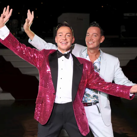 Craig Revel strikes the same dance pose alongside his wax figure at Madame Tussauds Blackpool