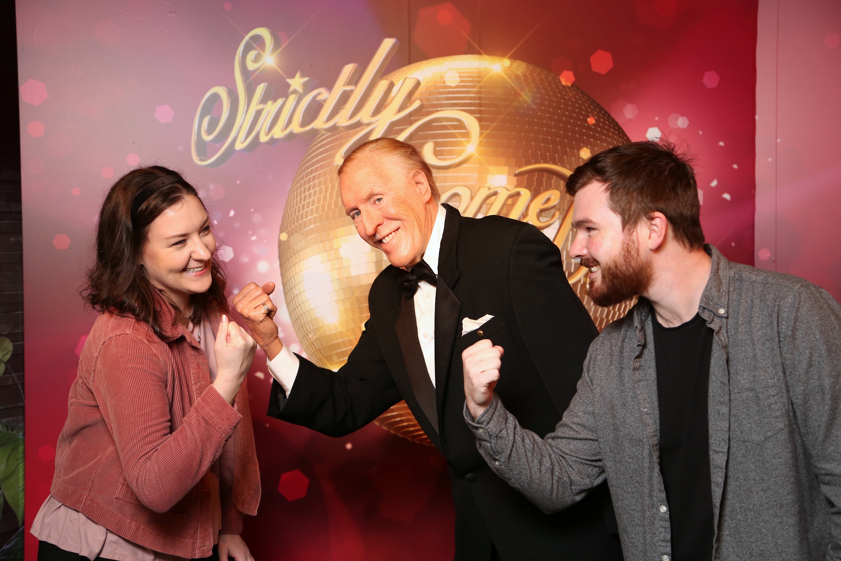 Guests with Bruce Forsyth's wax figure at Madame Tussauds Blackpool