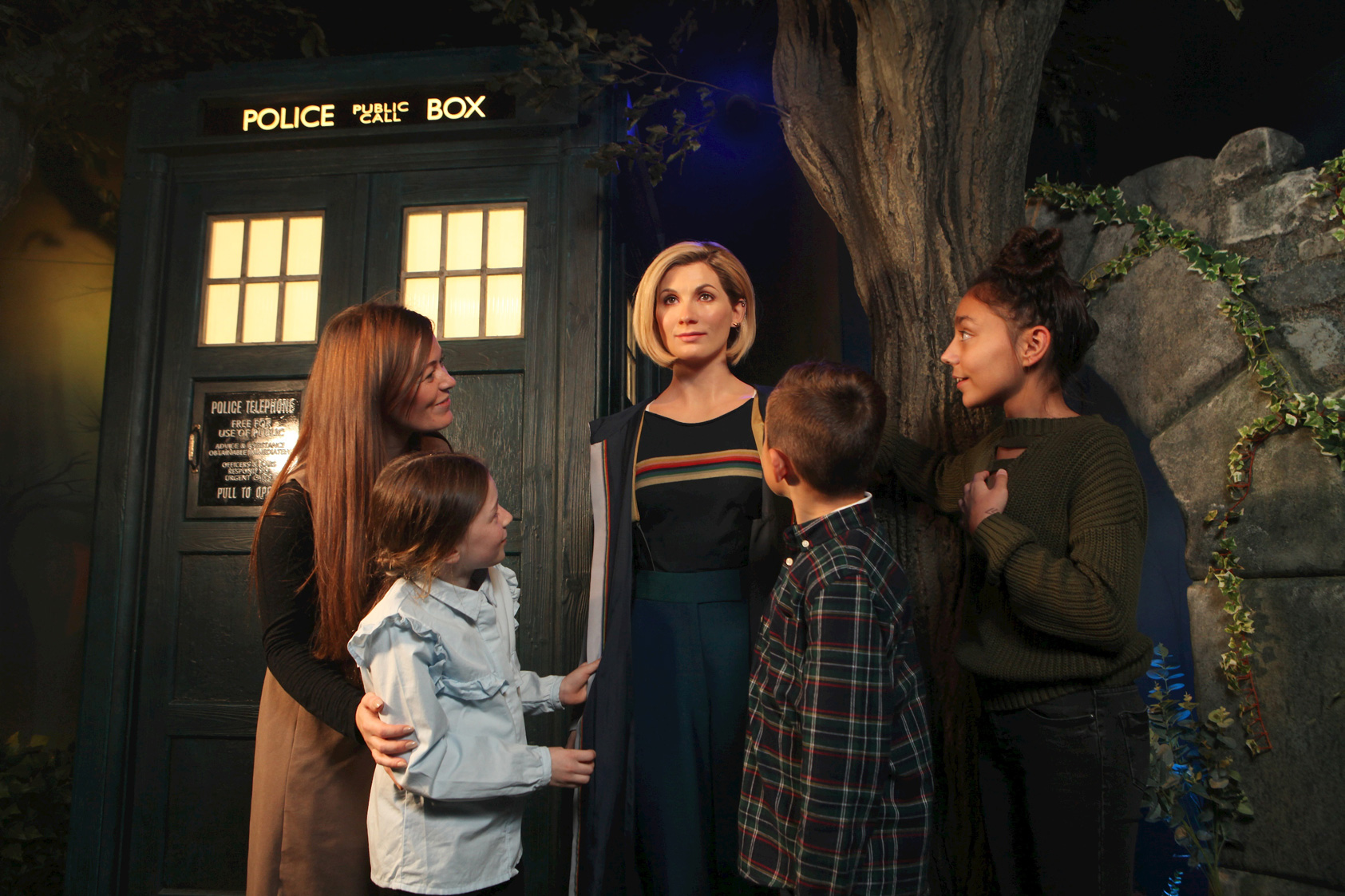 Guests visiting the Dr. Who wax figure at Madame Tussauds Blakcpool