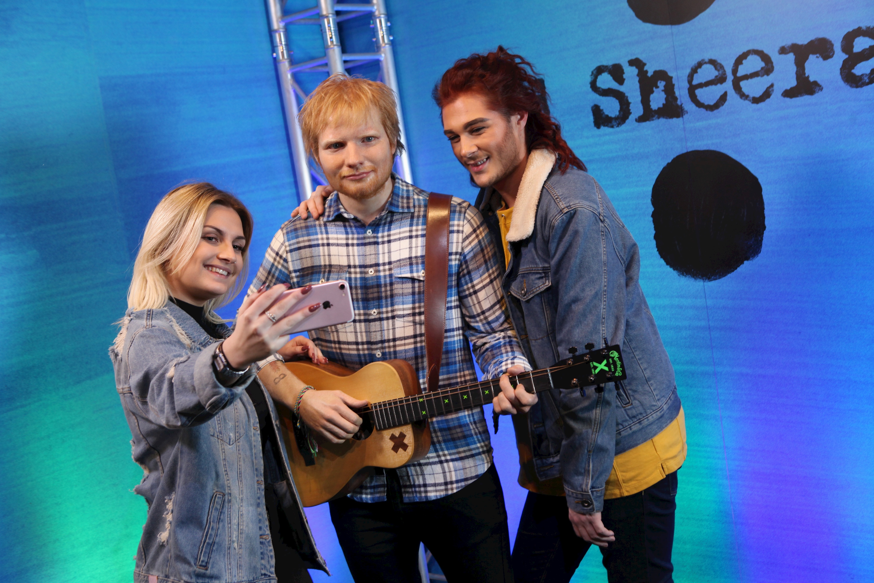 Guests taking a selfie with Ed Sheeran's wax figure at Madame Tussauds Blackpool