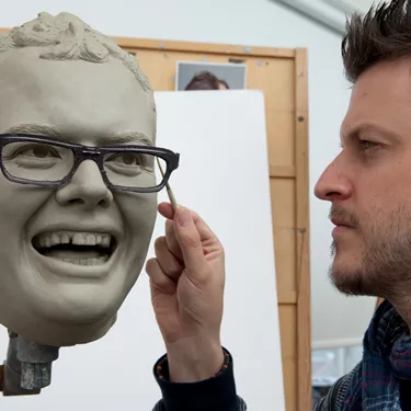 Alan Carr wax figure in clay being worked on