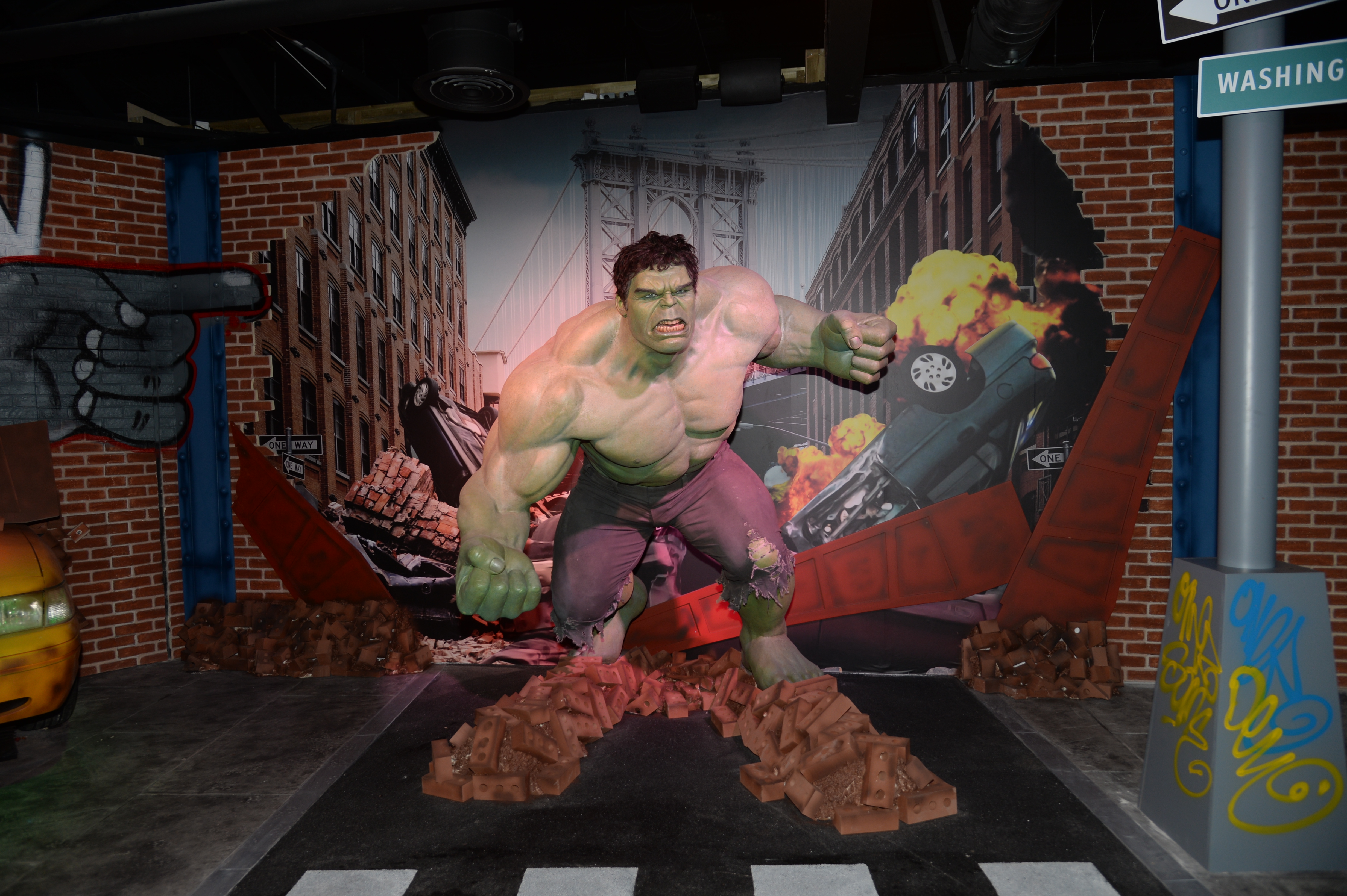 The Hulk figure smashing through a building on a New York set at Madame Tussauds Blackpool