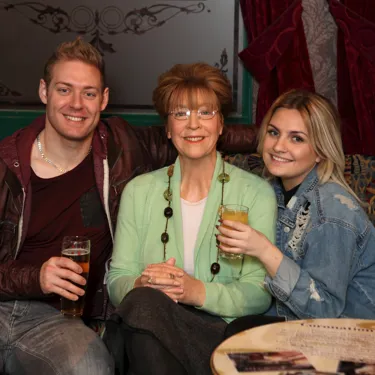 Guests take their photo with Deidre Barlow's wax figure in Rovers Return at Madame Tussauds Blackpool