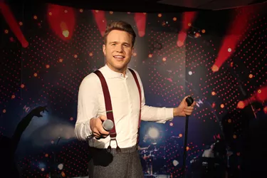 Olly Murs holding a mic wax figure at Madame Tussuads Blackpool