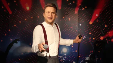 Olly Murs holding a mic wax figure at Madame Tussuads Blackpool