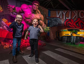 Children with the Hulk wax figure at Madame Tussauds Blackpool, UK