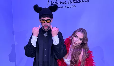 Fan posing with Bad Bunny wax figure at Madame Tussauds Hollywood