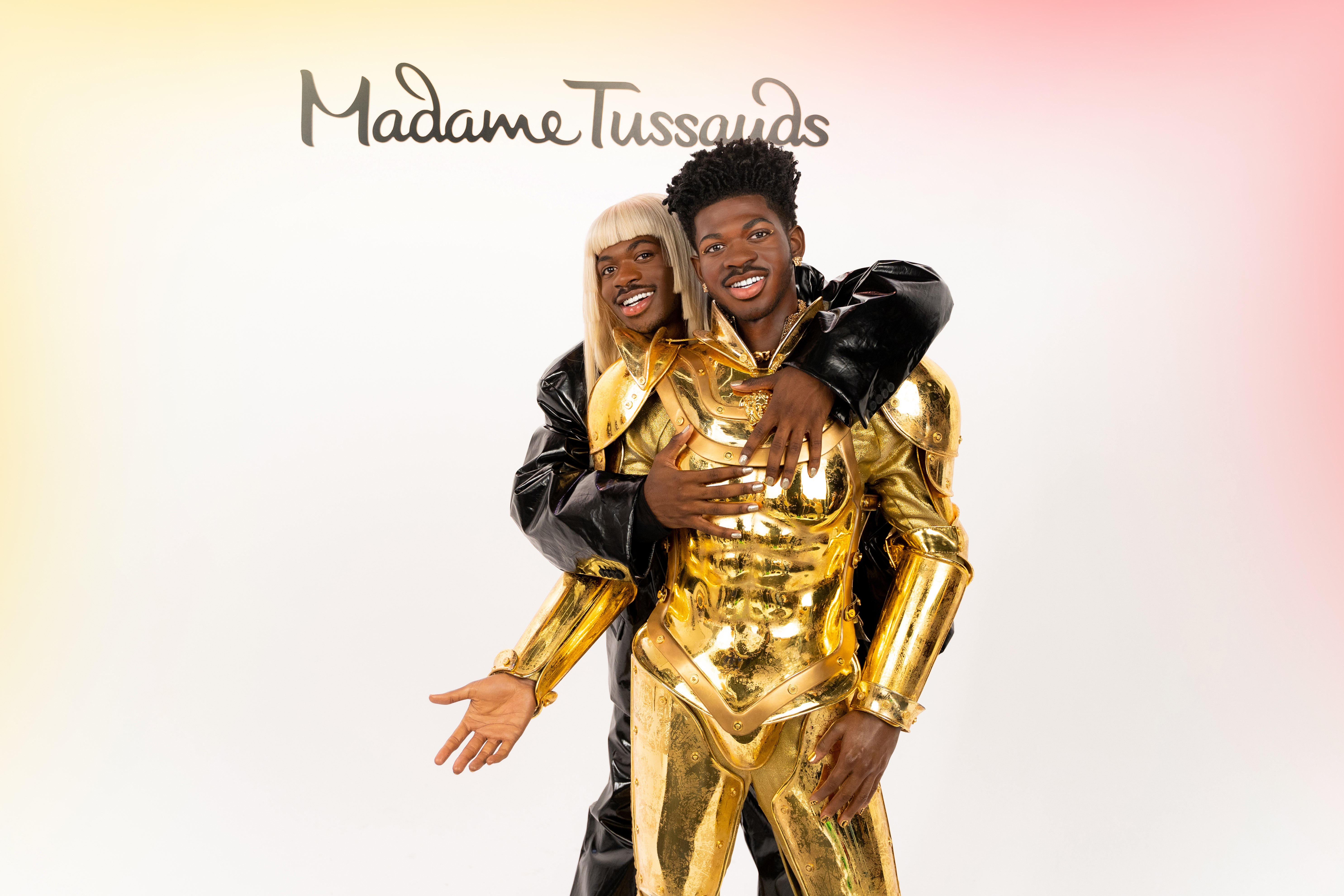 Lil Nas X poses with his wax figure