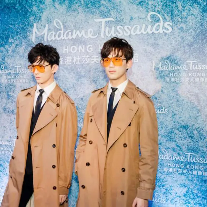 Wax figure of the award-winning Chinese actor Wu Lei (Leo Wu) in a trench coat.