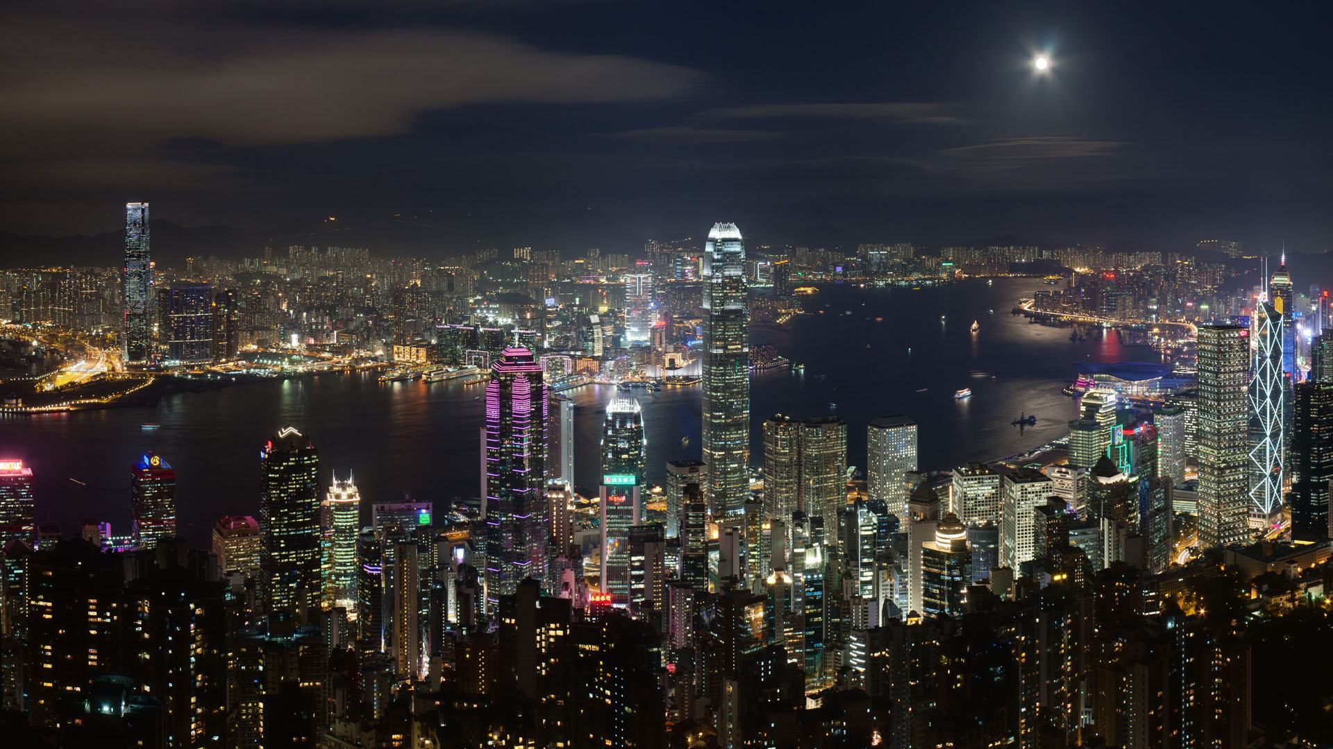 Captivating photo showcasing the panoramic night view of the iconic Hong Kong skyline  offering visitors a unique and unforgettable experience