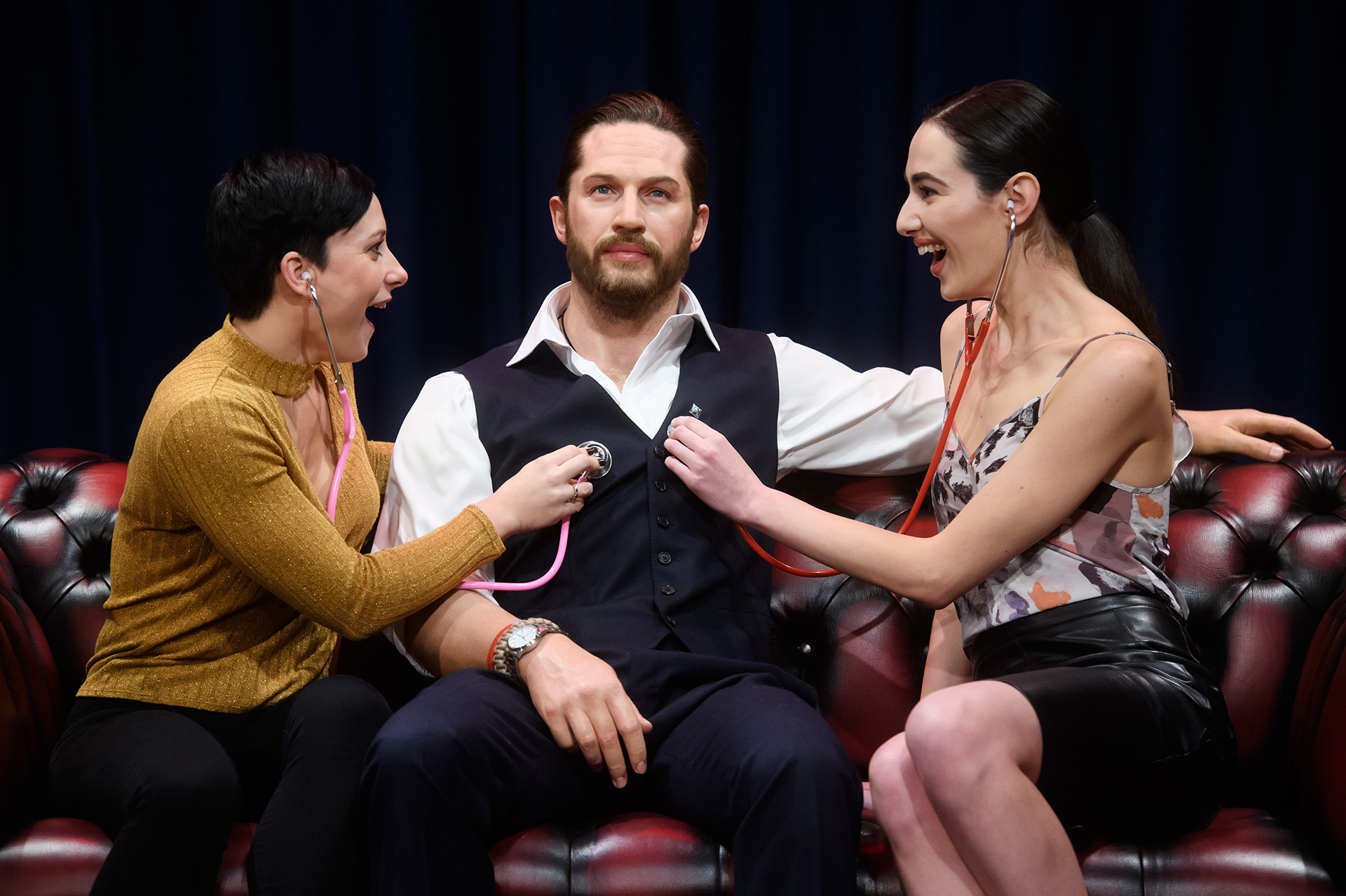 Fans interacting with Tom Hardy figure at Madame Tussauds London