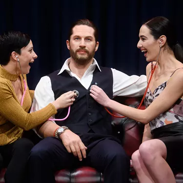 Fans interacting with Tom Hardy figure at Madame Tussauds London