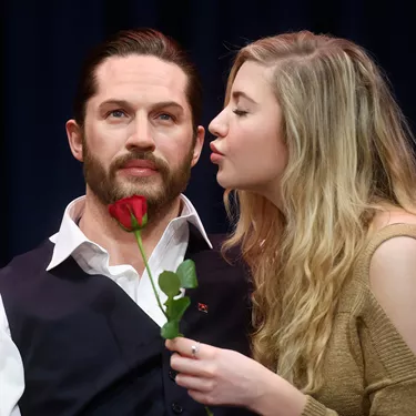 A fan giving Tom Hardy figure a kiss at Madame Tussauds London