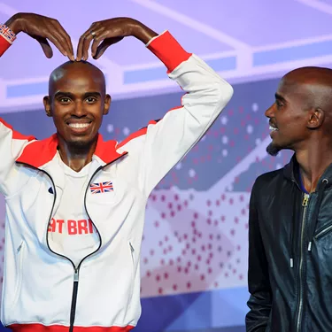 Mo Farah looking at his own figure at Madame Tussauds London