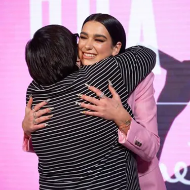 Dua Lipa hugging a fan