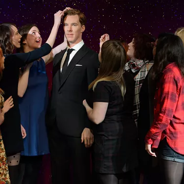 Fans interacting with Benedict Cumberbatch figure at Madame Tussauds London