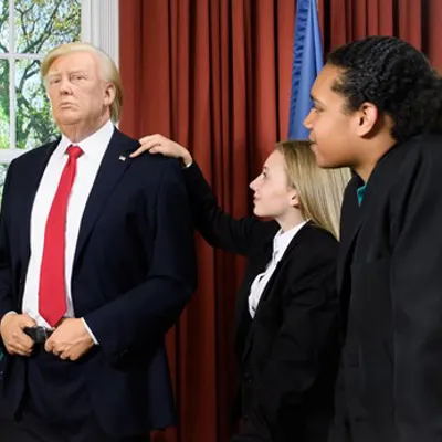 Students with Donald Trump's figure