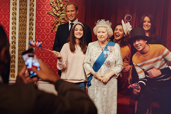 Family with the Queen at Madame Tussauds London