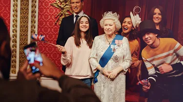 Family with the Queen at Madame Tussauds London