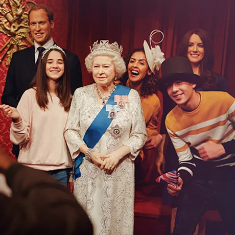 Family with the Queen at Madame Tussauds London