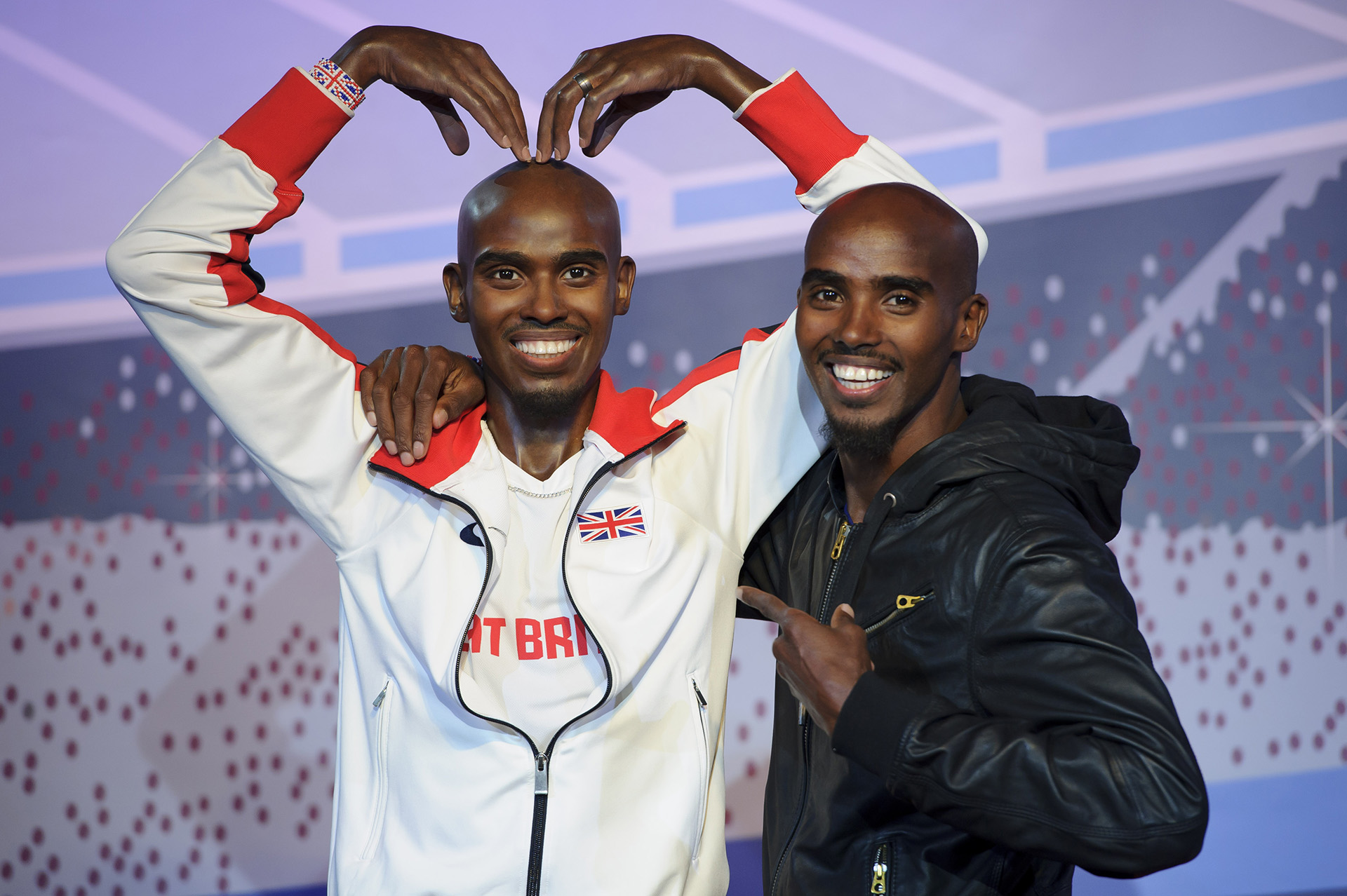 Mo Farah with his own figure at Madame Tussauds London