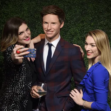 Fans taking a selfie with Eddie Redmayne figure