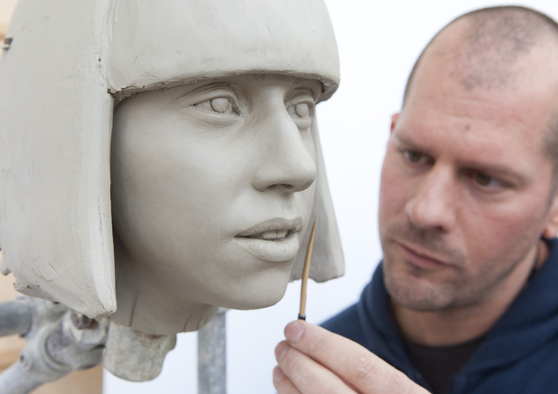 Sculptor working on Lady Gaga sculpture