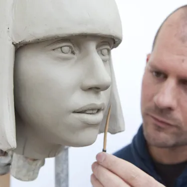 Sculptor working on Lady Gaga sculpture