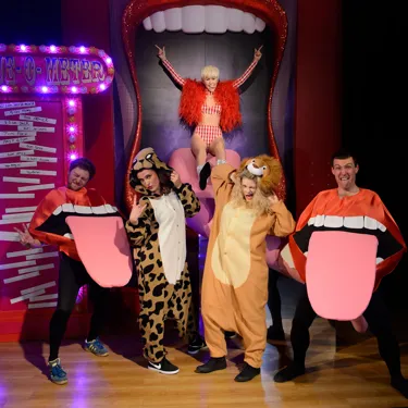 Group picture of fans and Miley Cyrus figure