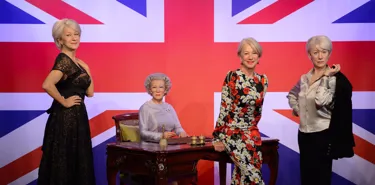 Dame Helen Mirren with her figures