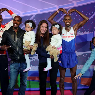 Mo Farah and his family with his figure at Madame Tussauds