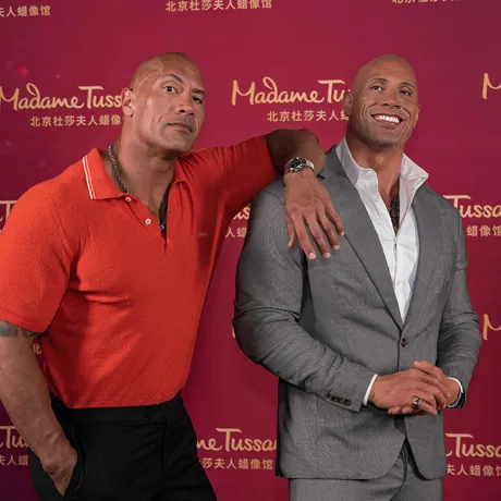 Dwayne Johnson with his figure at Madame Tussauds