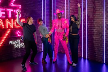 Group photo with famous wax figure at awards party