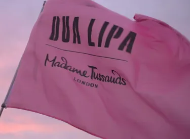 Dua Lipa and Madame Tussauds' flag