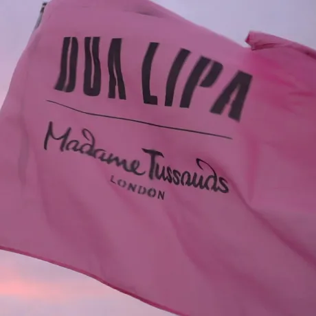 Dua Lipa and Madame Tussauds' flag