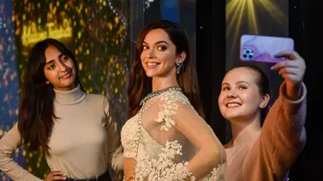 Guests taking photo with Deepika Padukone wax figure at Madame Tussauds London