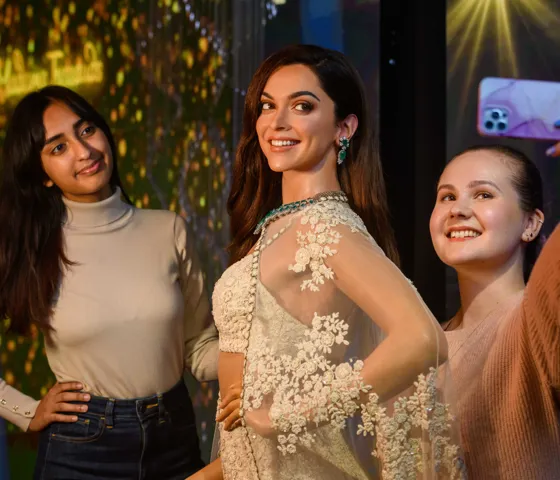Guests taking photo with Deepika Padukone wax figure at Madame Tussauds London