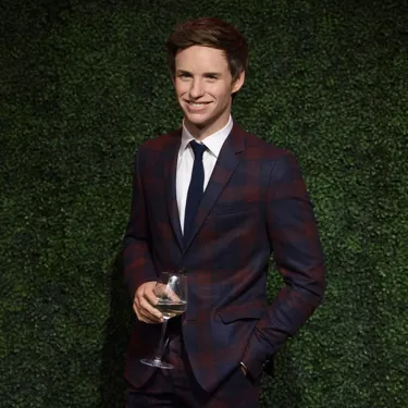 Eddie Redmayne figure holding a glass of wine at Madame Tussauds