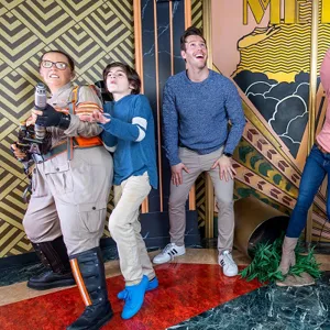 Guests posing with wax figures from the 2016 Ghostbusters movie