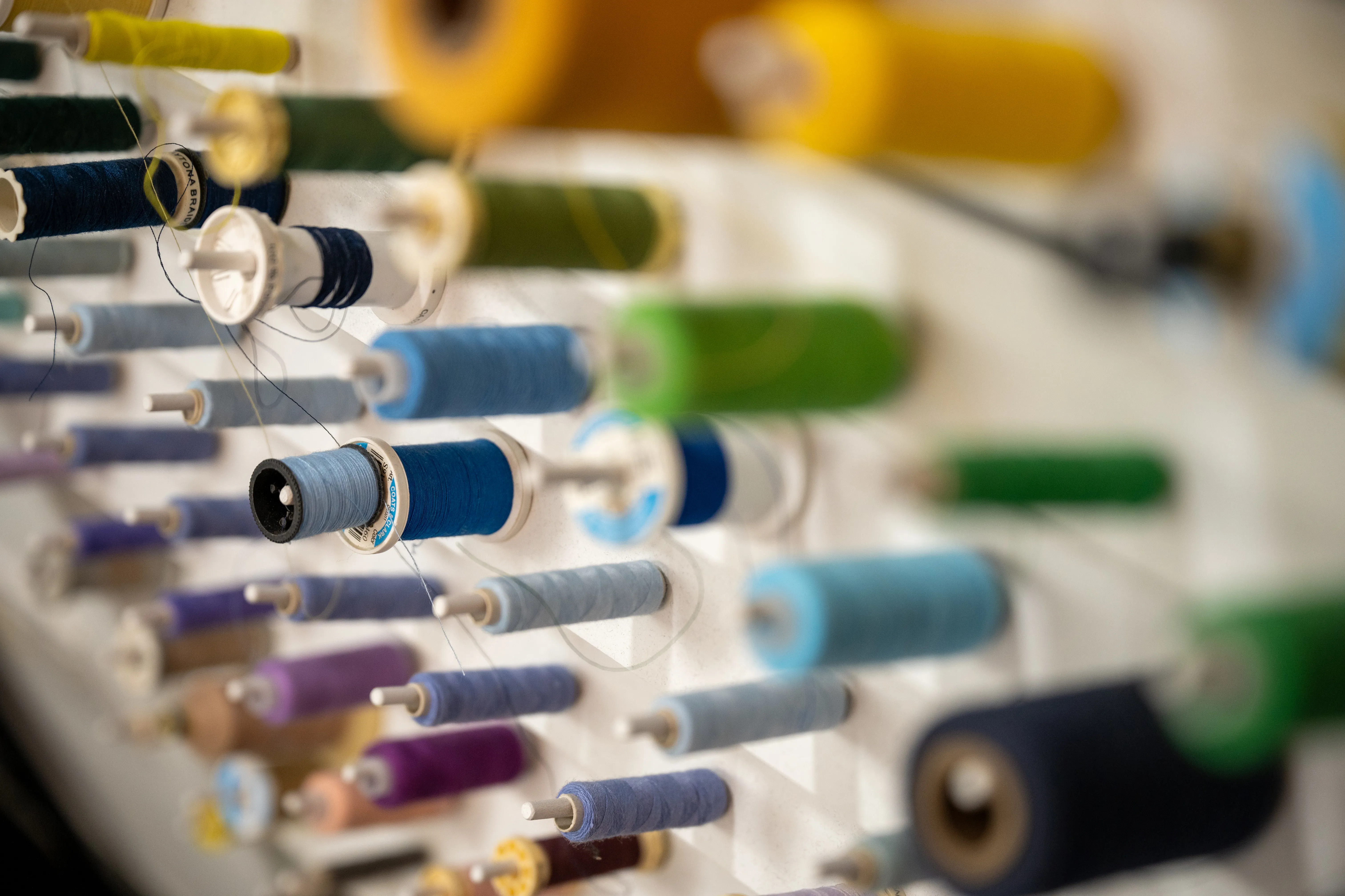 Image showing a large number of spools of sewing threads