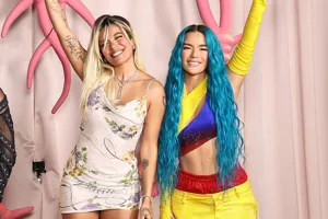 karol g in white and wax karol g in Columbia flag colored outfit