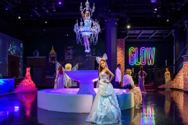 Glow Gala area at Madame Tussauds New York featuring wax figures of Ariana Grande and Katy Perry.