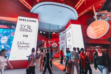 Outside view of Madame Tussauds with SYTA logo displayed on screens