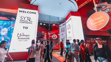 Outside view of Madame Tussauds with SYTA logo displayed on screens